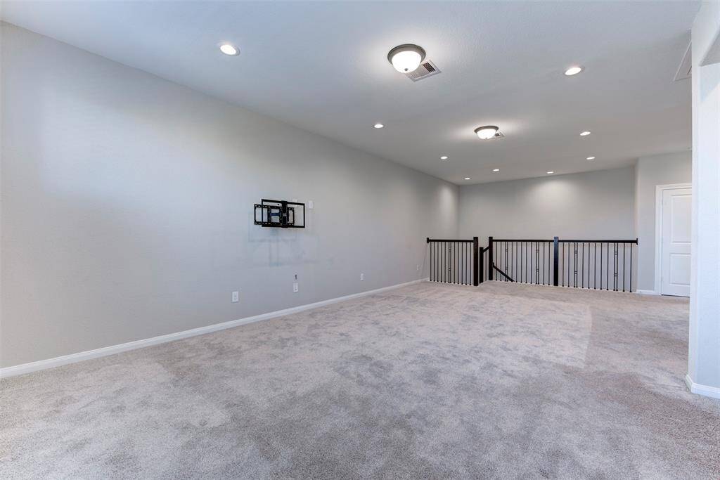 Expansive Upstairs Gameroom with Desk