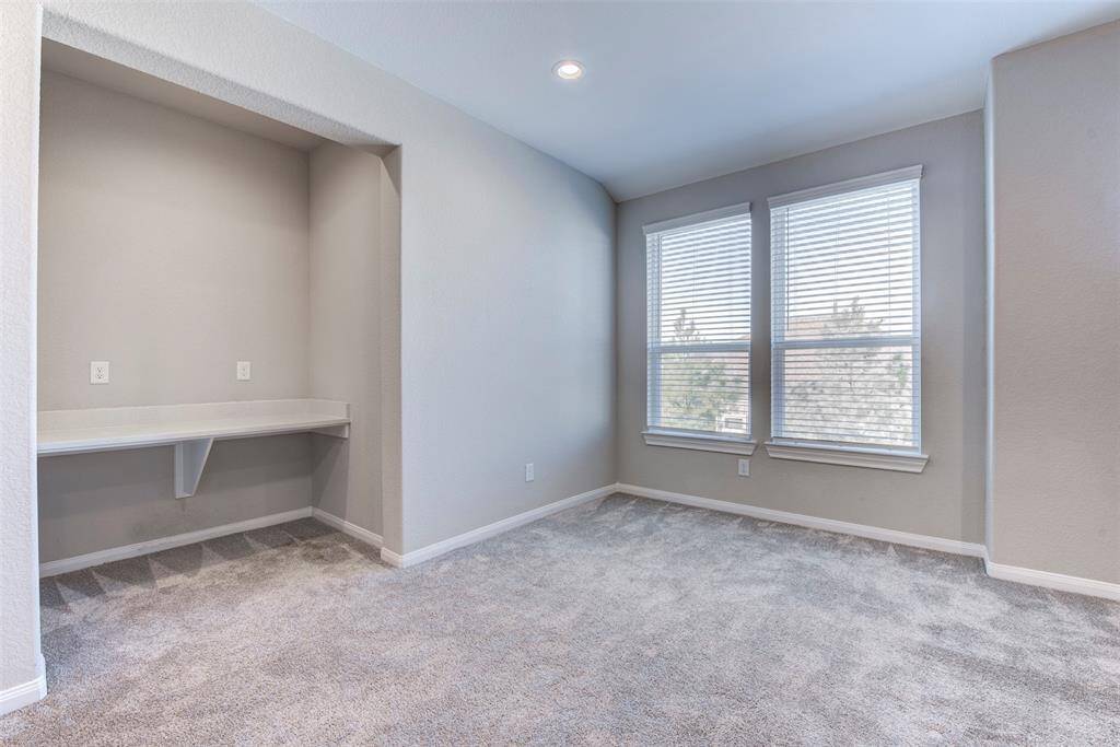 Expansive Upstairs Gameroom with Desk