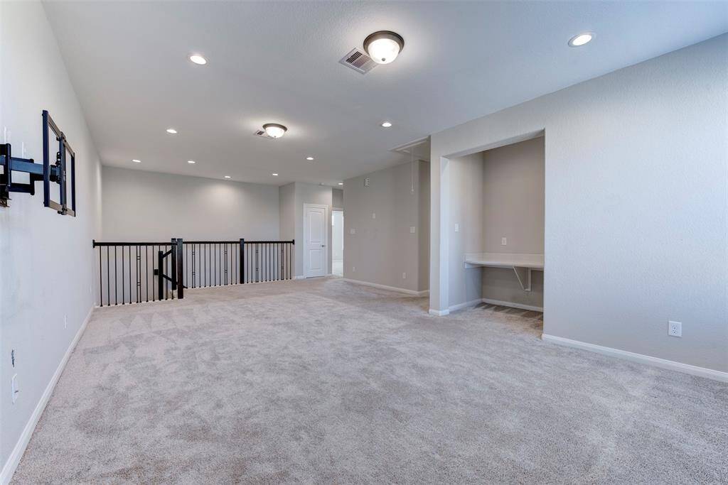 Expansive Upstairs Gameroom with Desk