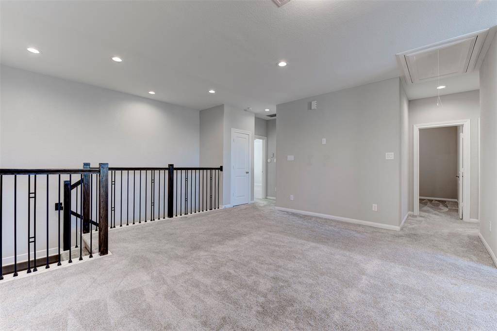 Expansive Upstairs Gameroom with Desk