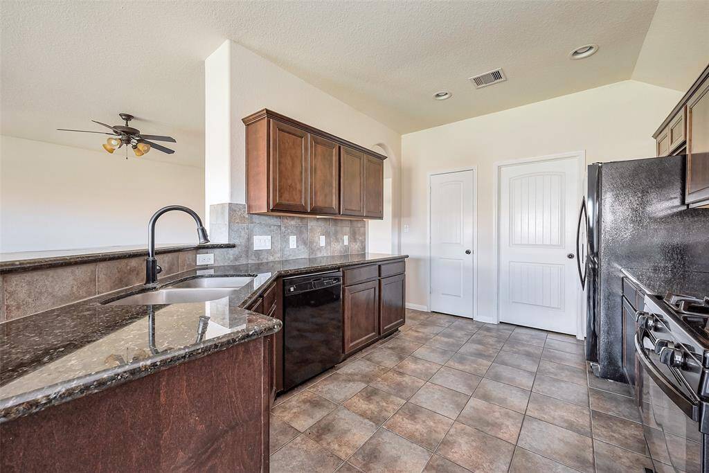 Granite countertops with huge cabinets.
