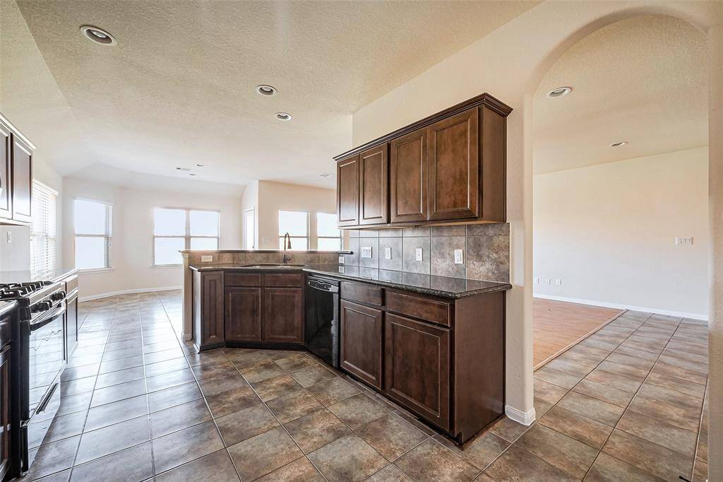 View from the laundry room of the kitchen and breakfast area.