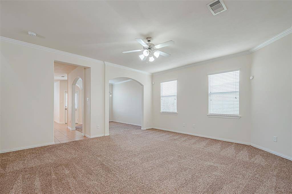 Living area open to kitchen and formal dinnning area.
