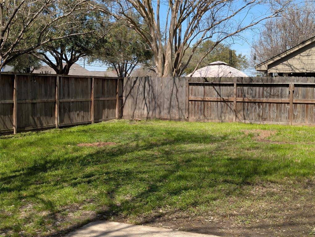 Back yard is fully fenced.