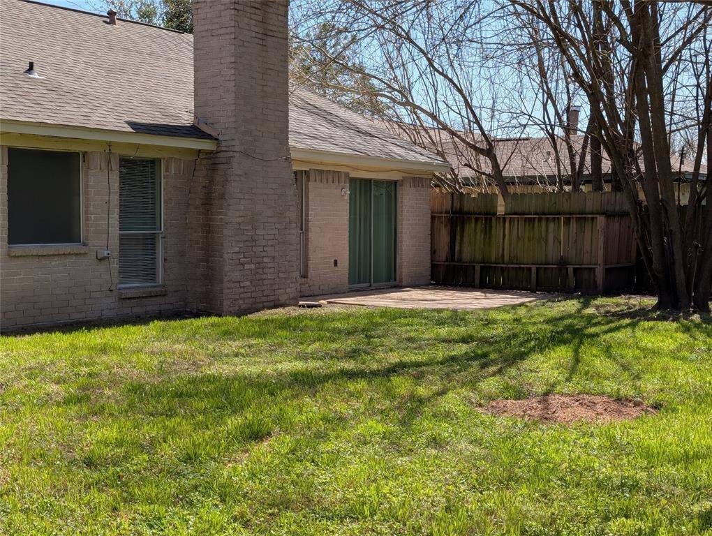 Showing fireplace and patio that leads out from dining area.