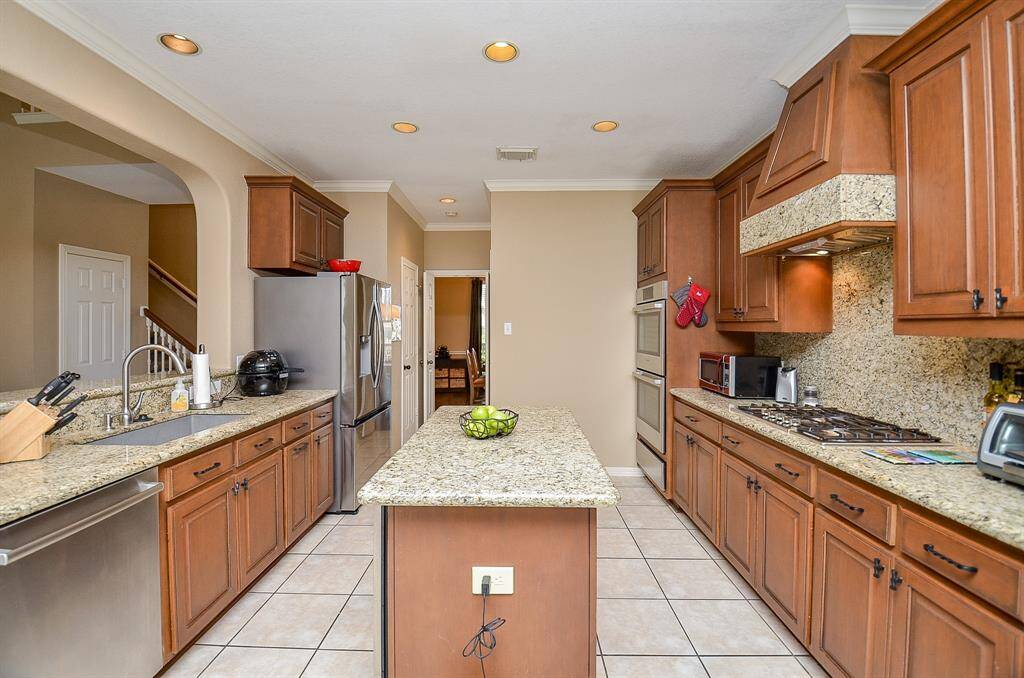This kitchen boasts Granite Counters, Stainless Steel Appliances and so much more!