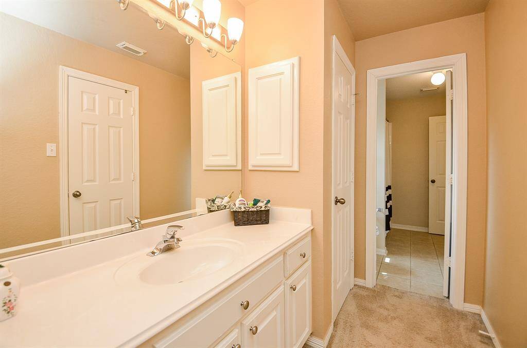 Showing off one of the vanities in the Jack and Jill bathroom upstairs .  Bedroom 2&3 each have their own private vanity and closet.