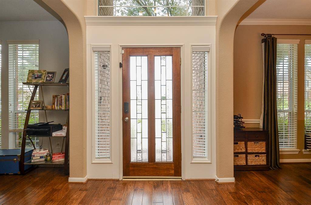 Front door is wood with glass inserts!
