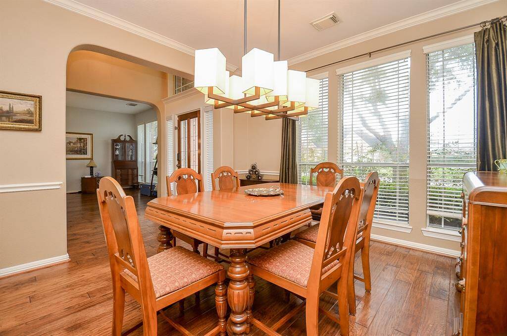Dining Room offers hardwood flooring plus an updated fixture.