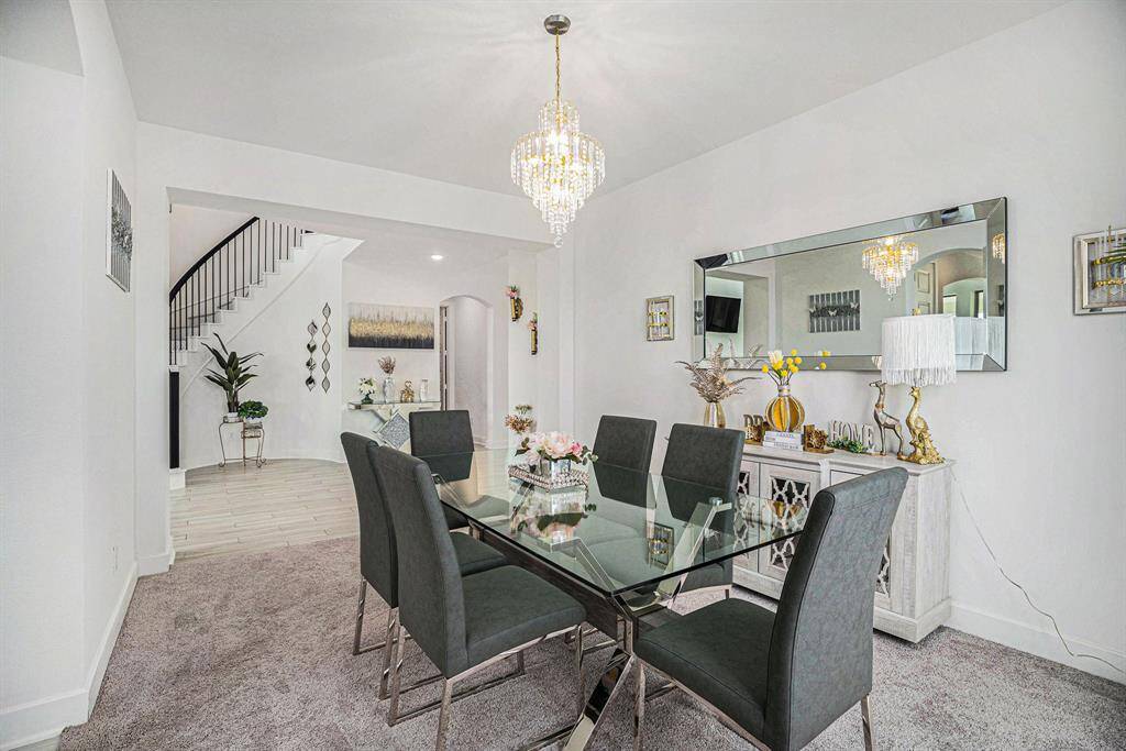Stylish chandelier serves as a elegant focal point.