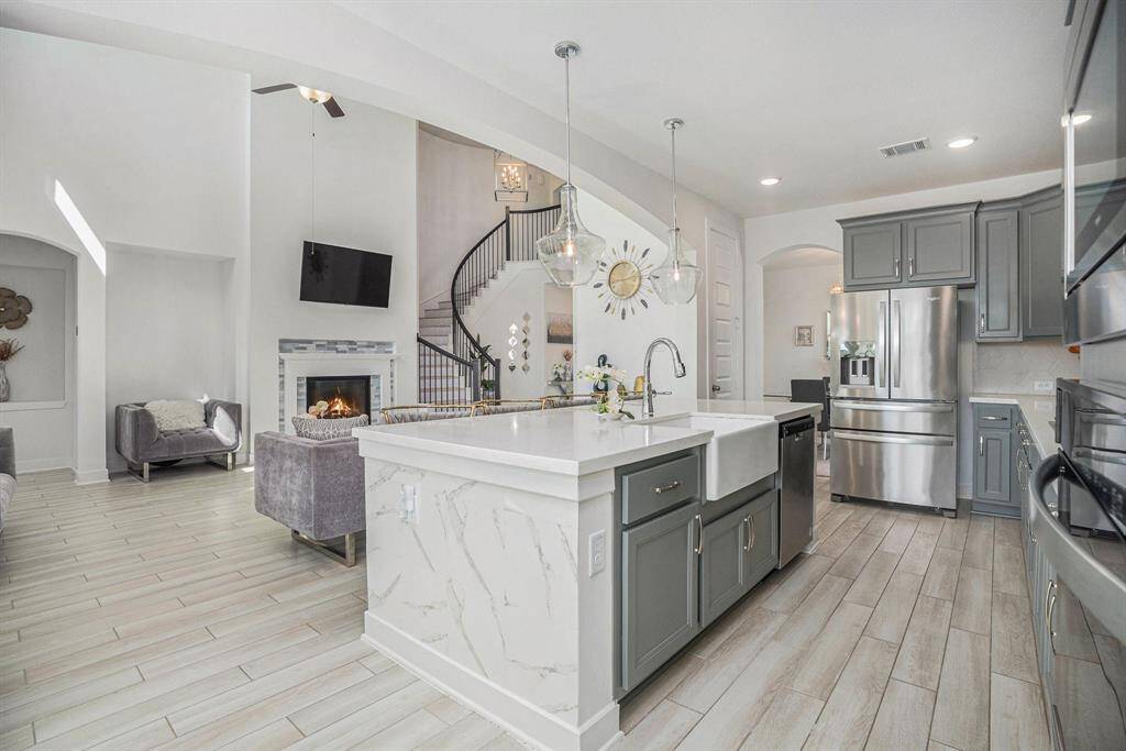 Spacious island kitchen open to living area.
