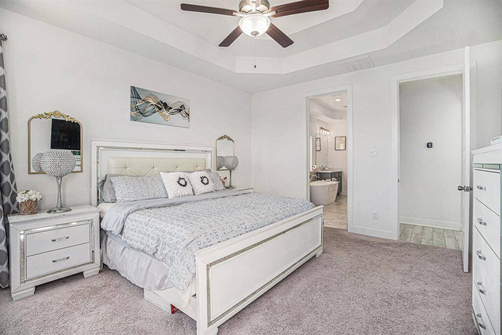 The luxurious primary suite offers the perfect blend of sophistication and relaxation.