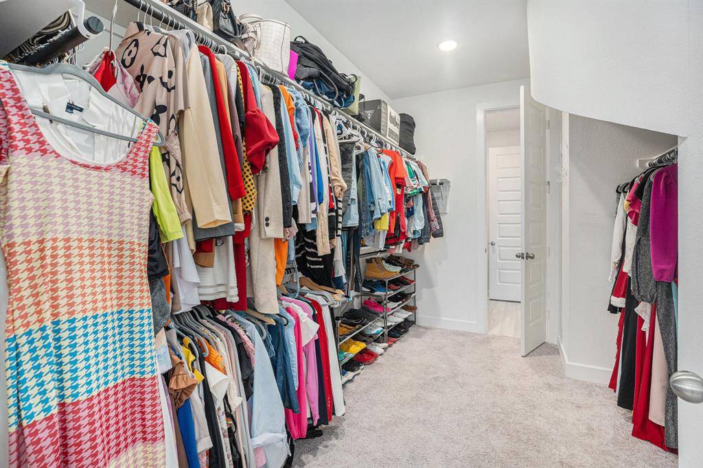 Large primary walk-in closet.