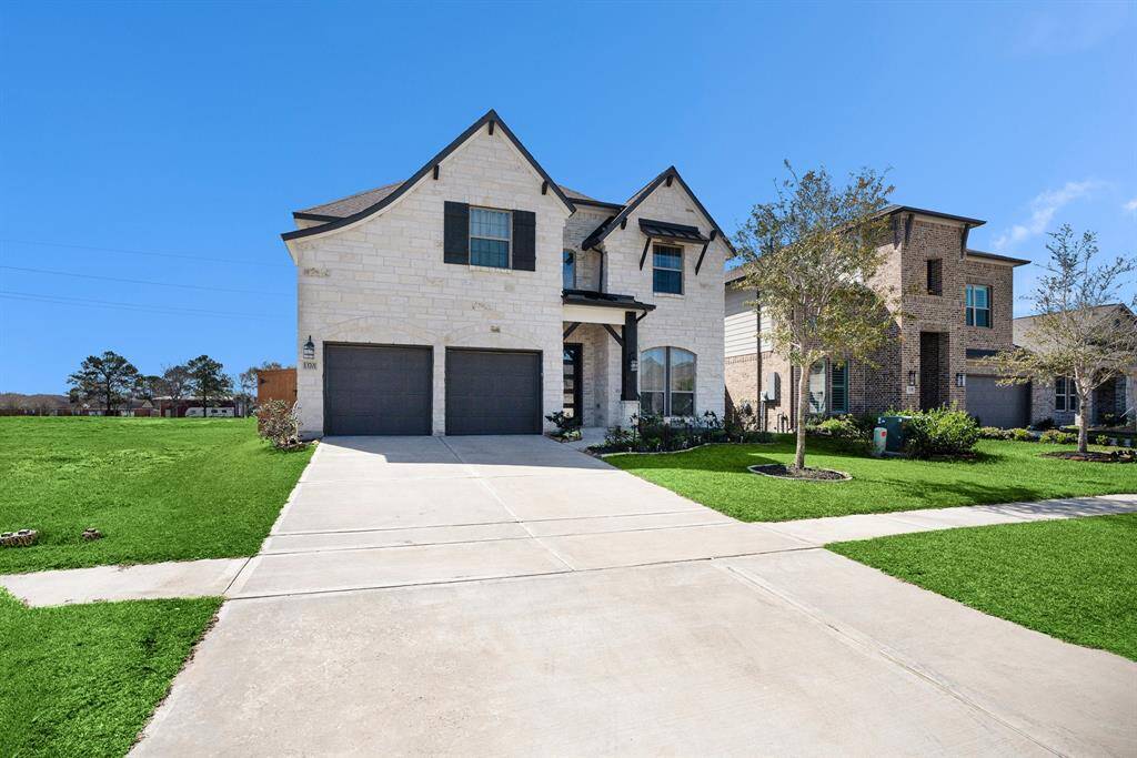 Beautiful curb appeal with stone exterior.