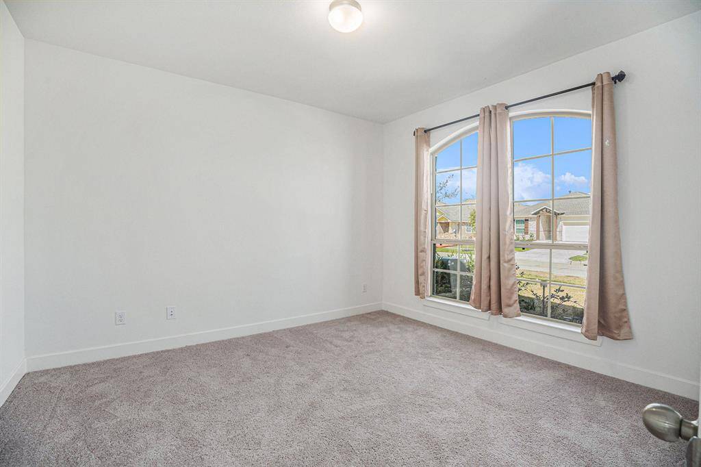 Study is located right off the entry, with large window to look out to the front yard.