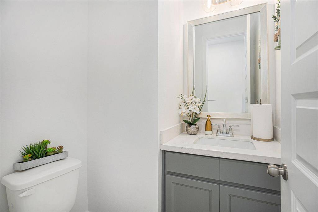 Half bath downstairs powder room for guests.