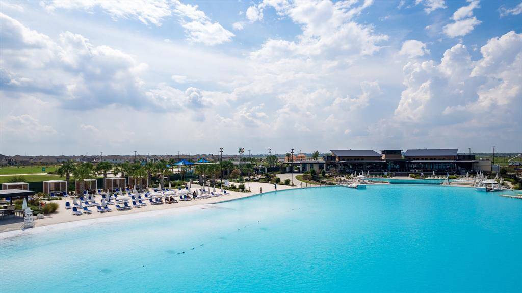 Lounge on the white-sand beach at the crystal lagoon!