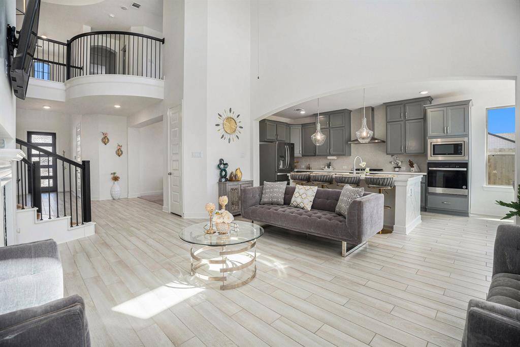 The open-concept living area offers a spacious flow, perfect for living and entertaining.