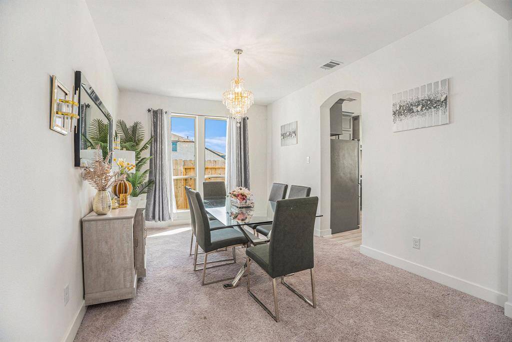 Formal dining right off the kitchen perfect for hosting guests.