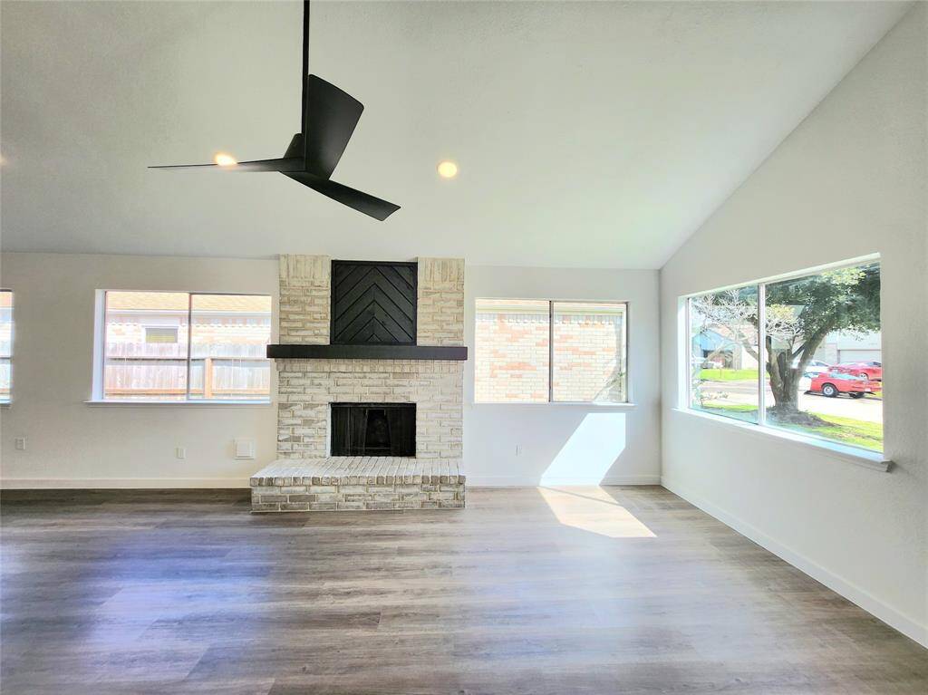 Chimney surrounded by tons of natural lighting.