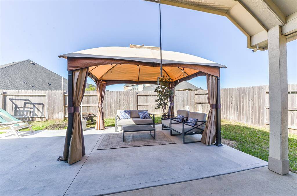 Oversized concrete pad added! Great for entertaining. Covered porch can stay.