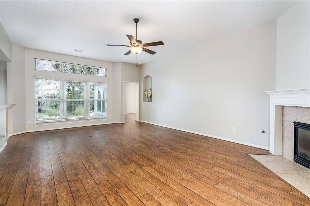 ...with a window overlooking the landscaped backyard…