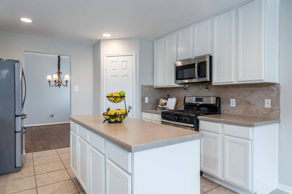The expansive island kitchen with gas stove for cooking your wonderful meals.