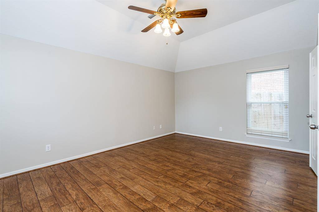 Primary bedroom offers enough space for all your furniture and room left over for a reading/sitting area.