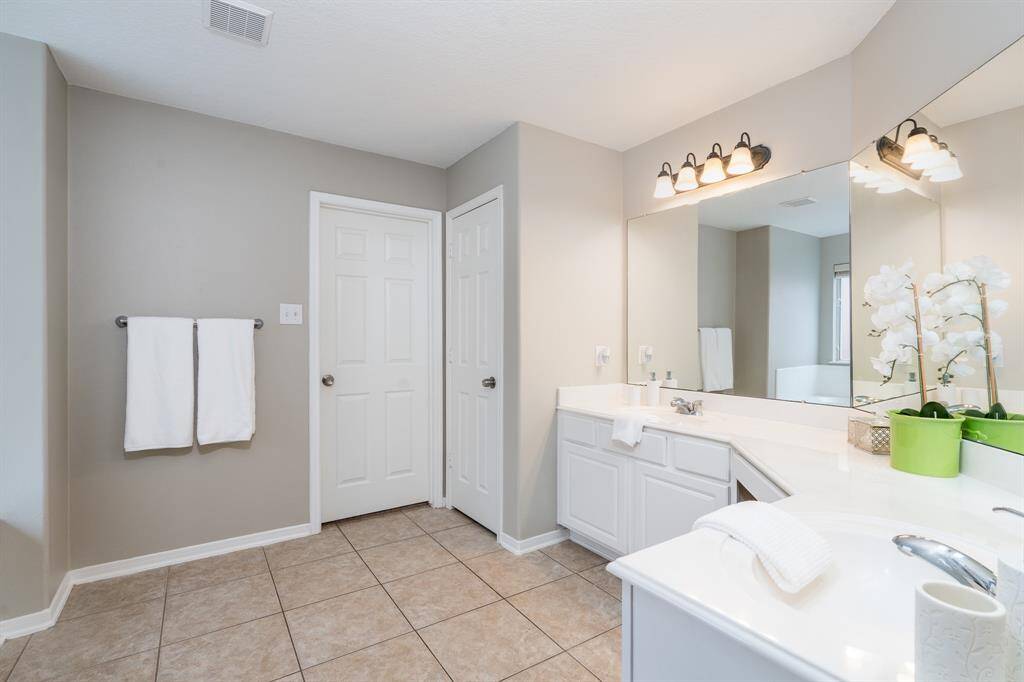 Dual sinks plus vanity in the primary bathroom!