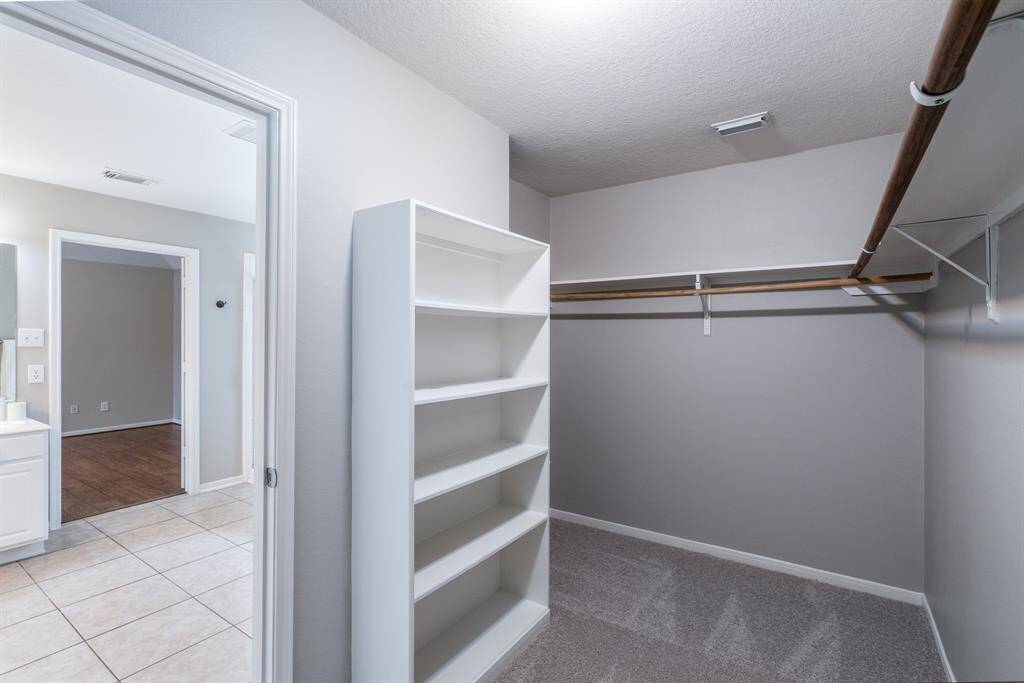 Primary walk-in closet with built-ins!