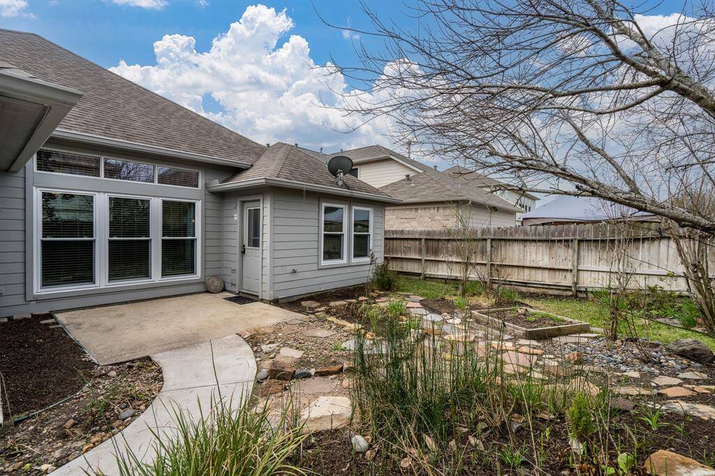 Two paved areas for lounging out back surrounded by Spring florals.