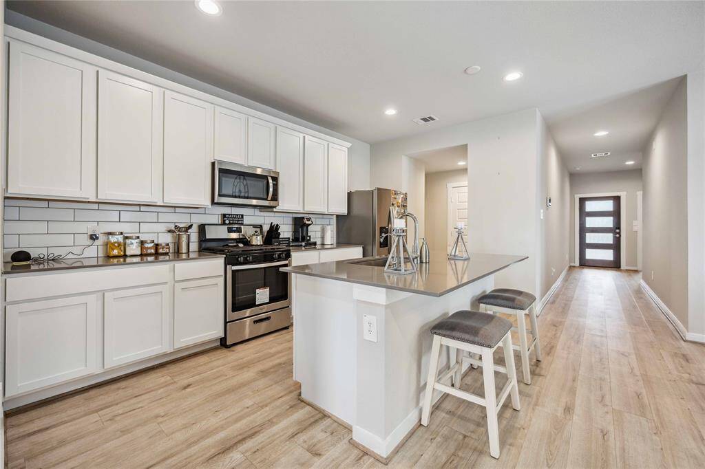Tall cabinets make for plenty of room for kitchen storage!