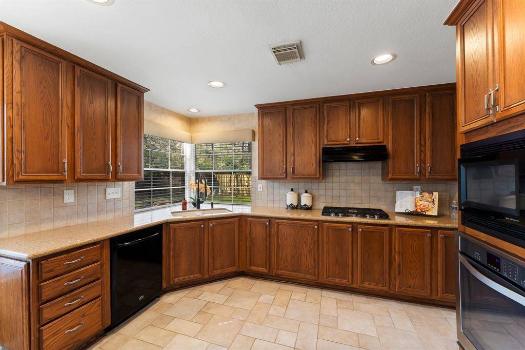 This kitchen has LOTS of Cabinets/prep area.