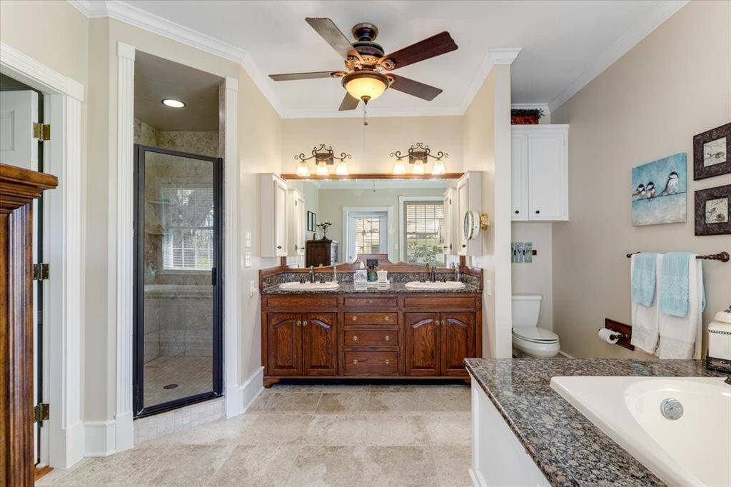 Primary Bathroom with soaking tub and standing shower.