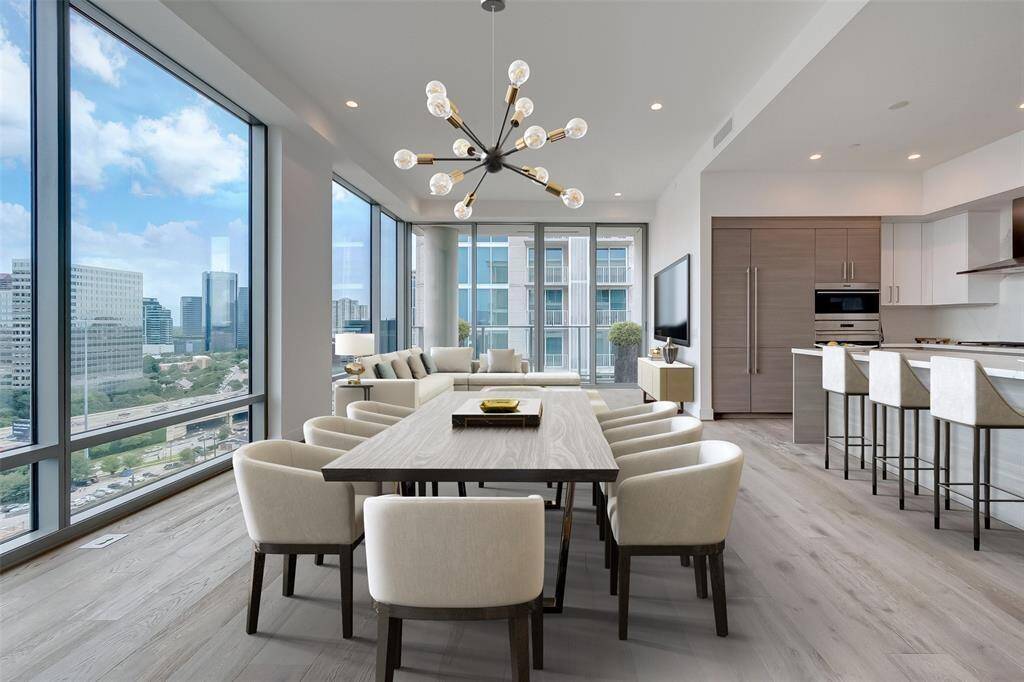 Open Concept Kitchen with sitting area , siematic self closing cabinets, sealed porcelain countertops, subzero Refrigerator and wolf appliances