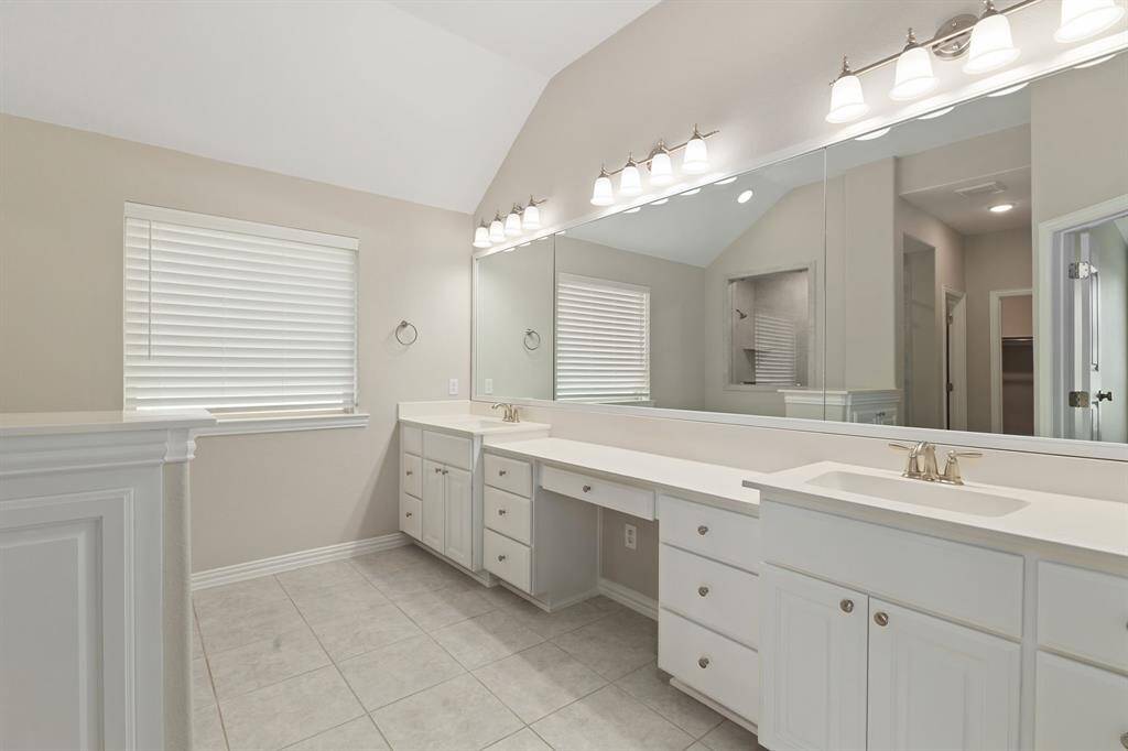 The primary bathroom features DOUBLE SINKS PLUS VANITY SPACE!