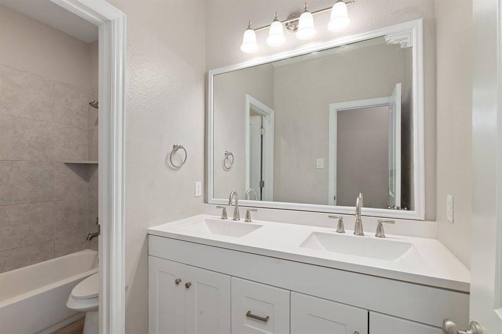 Secondary bathroom features DOUBLE SINKS AND A SEPARATE WET AREA!