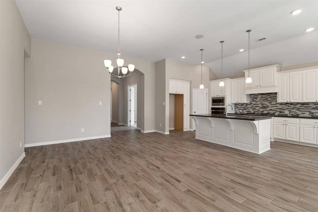 Another view of the dining area and kitchen!