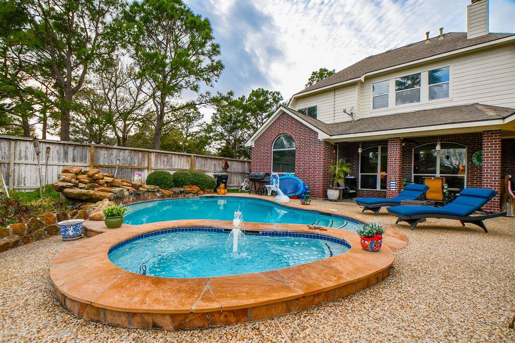 Welcome to your very own backyard oasis with spa and waterfall