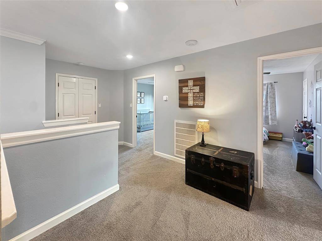 Open landing at the top of the stairs, leading to the bedrooms.