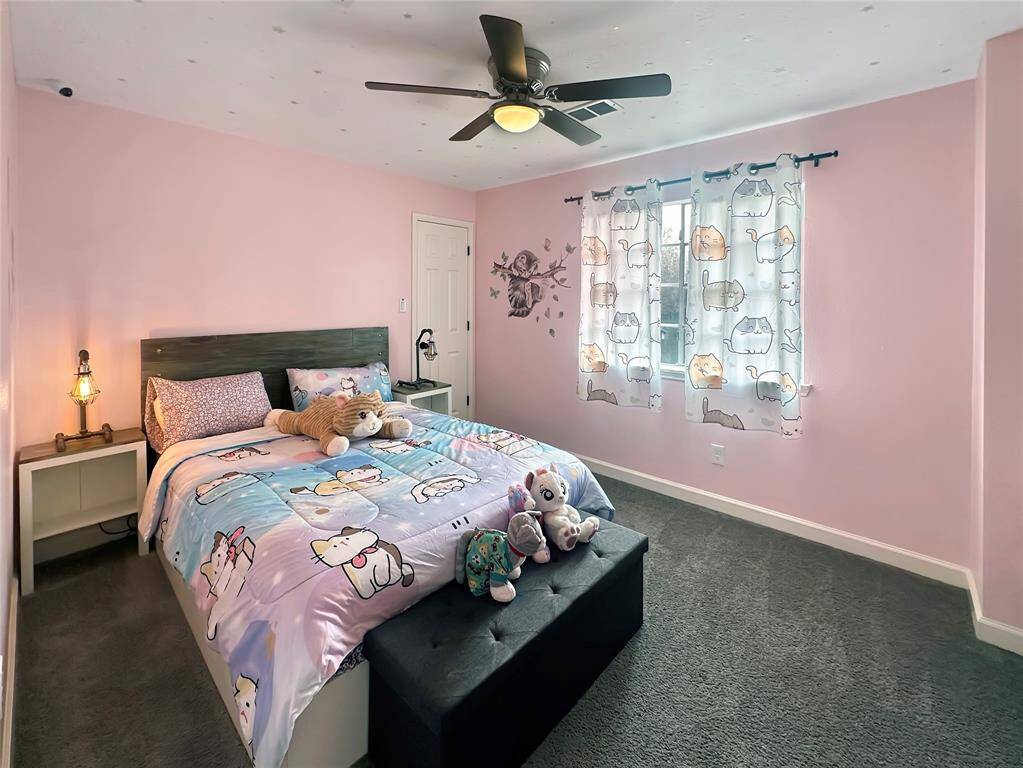 Cozy secondary bedroom with ample closet space and plenty of natural light.