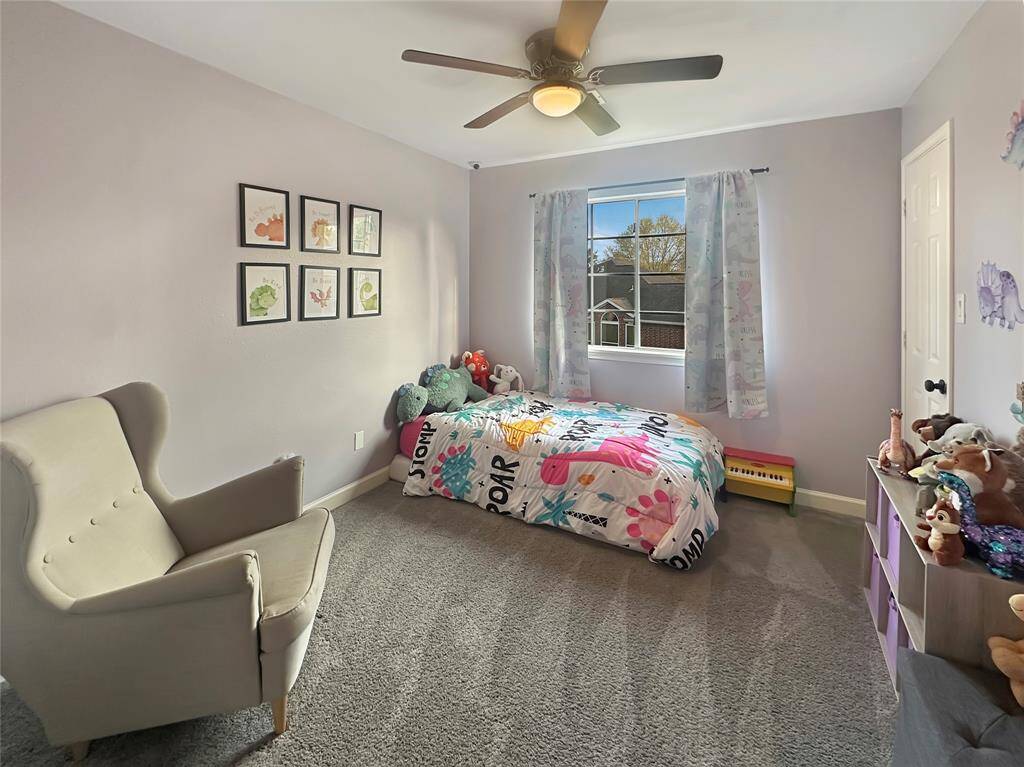 Cozy secondary bedroom with ample closet space and plenty of natural light.
