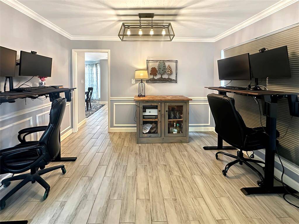 Formal dining room, thoughtfully staged as a functional home office, showcasing its versatility.