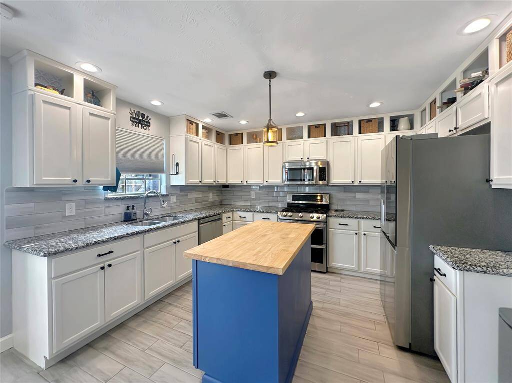 Kitchen has ample storage.