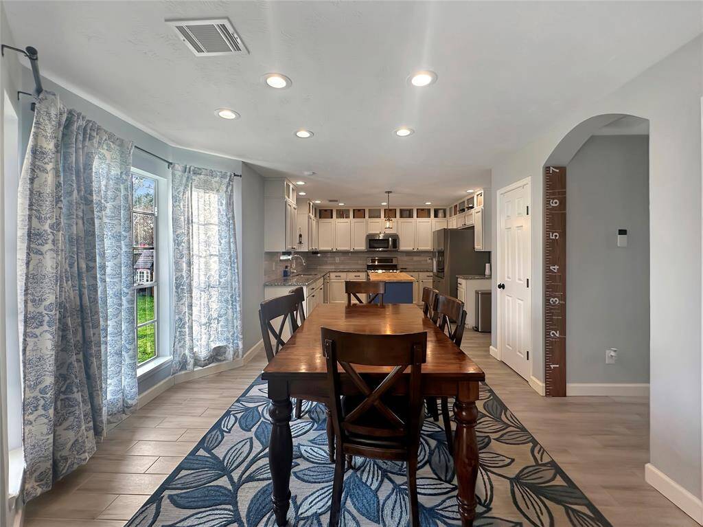 Spacious kitchen and eating area is a bright, welcoming atmosphere for dining and entertaining.