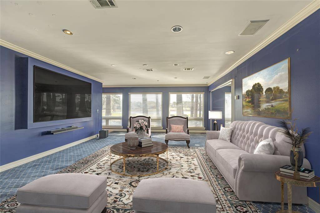 TV/Media area with 2023 new carpet  and paint.  Virtually staged.