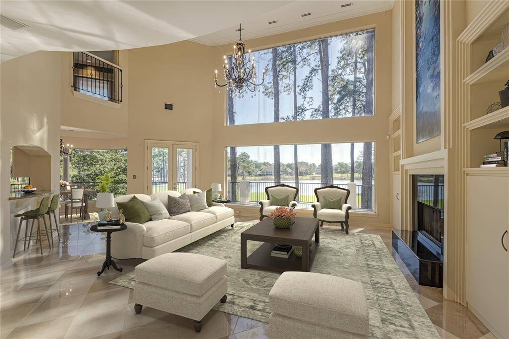 The centerpiece of the open floor plan, perfect for entertaining is the living room with soaring ceilings and incredible views overlook by private balcony from 2 bedroom suite. This is virtually staged.