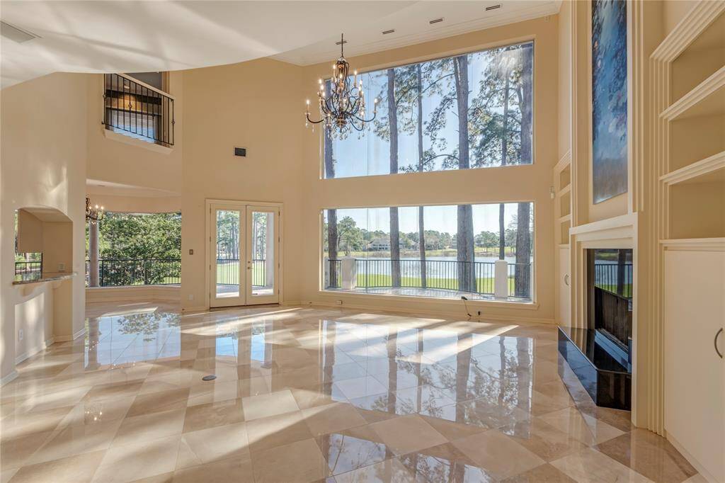 Open floorplan with 2023 updating tile floor and chandelier.  The views are spectacular.