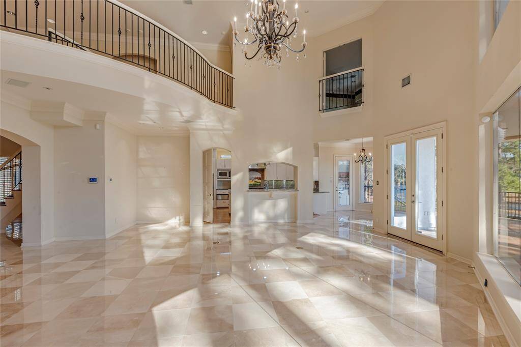 Another view of the living area with views into the kitchen, breakfast area, and walk way between bedrooms.