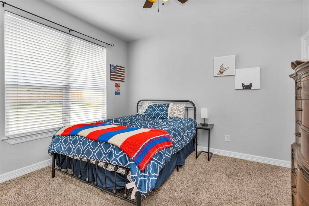 Secondary bedroom with view to the backyard. The 4th bedroom is currently used as a storage area (not pictured).